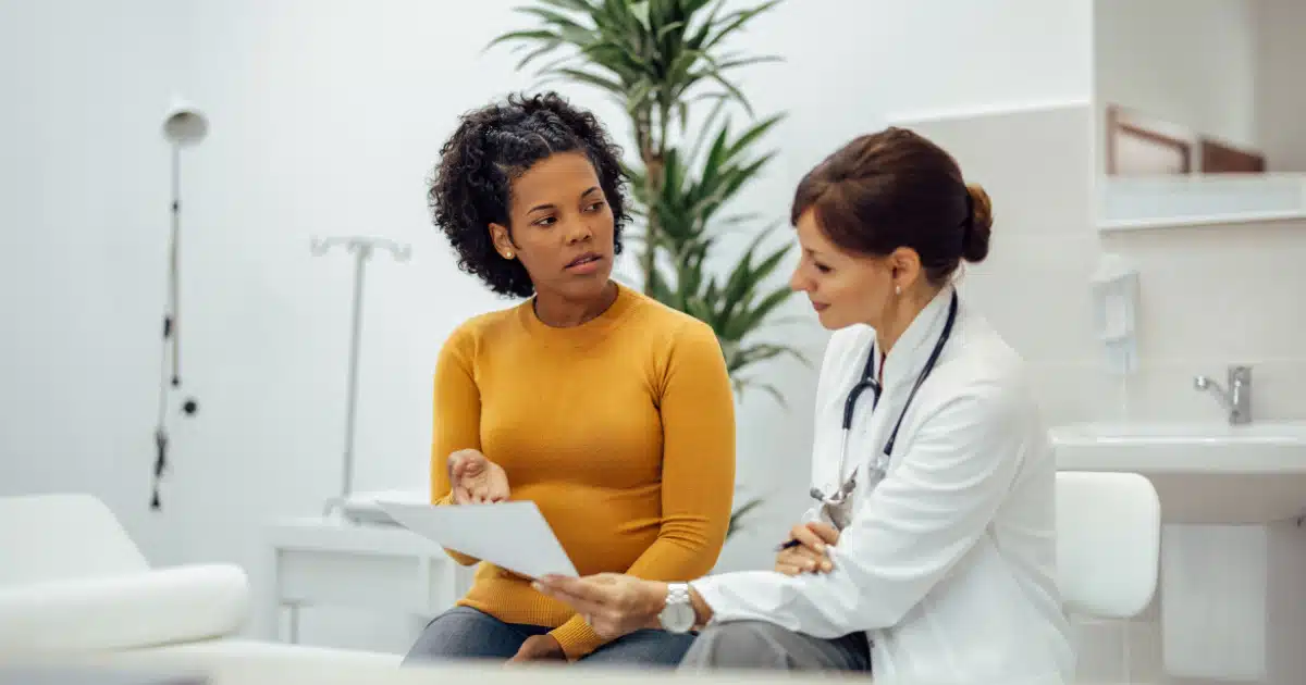 woman speaking to a doctor