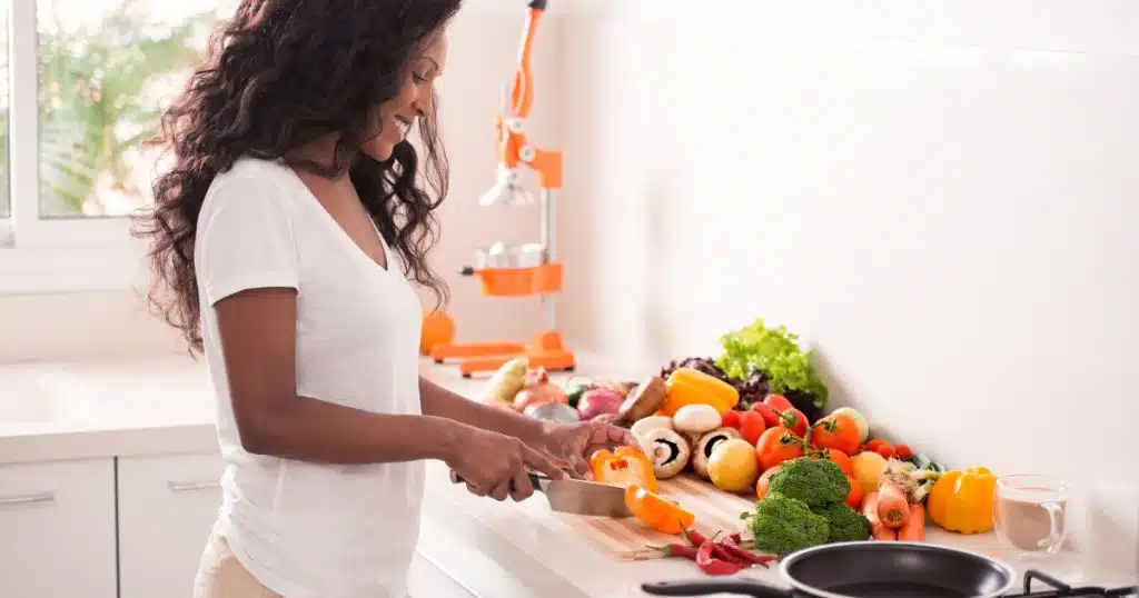 woman preparing healthy foods in a kitchen