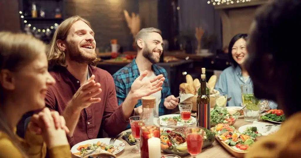 people Laughing while eating healthy food